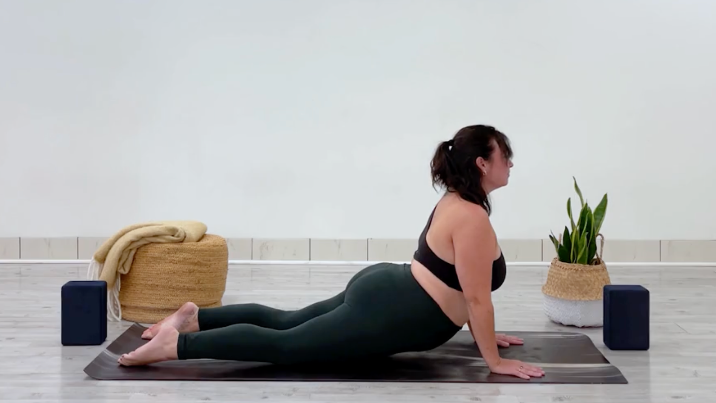 Yoga teacher Taylor Lorenz in Cobra Pose, Bhujangasana in Sanskrit, part of her yoga for balance practice